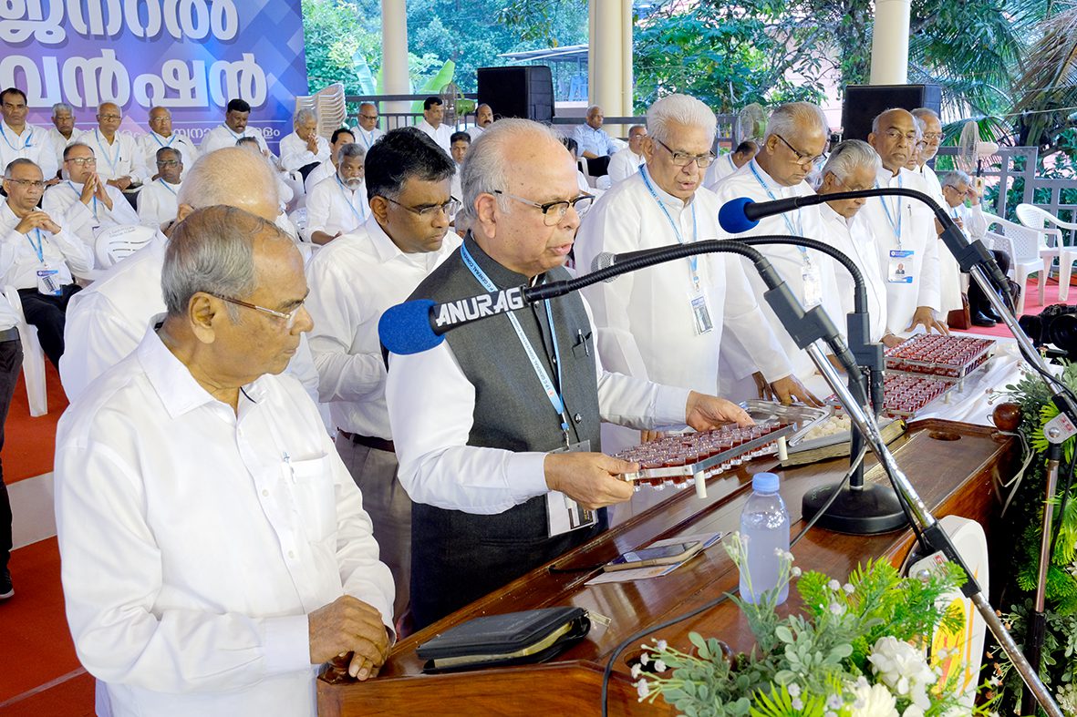 Rev. Dr. M.S. Samuel prays for the wine